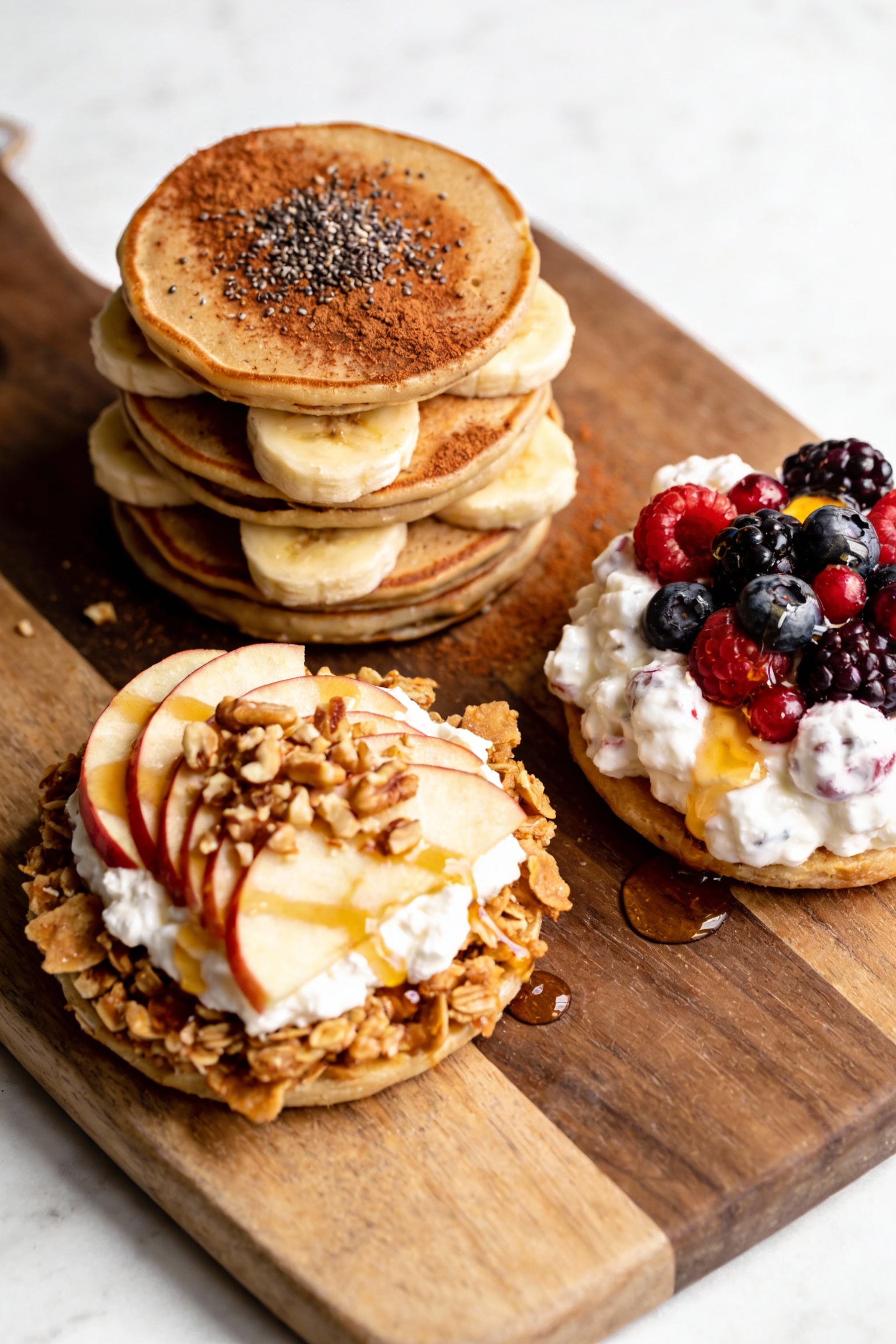 Tasty top view of a sweet snack trio on a serving board: Peanut Butter Banana Power Stack with cinnamon dusting and chia